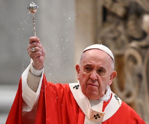 pope francis in bright orange and white robes