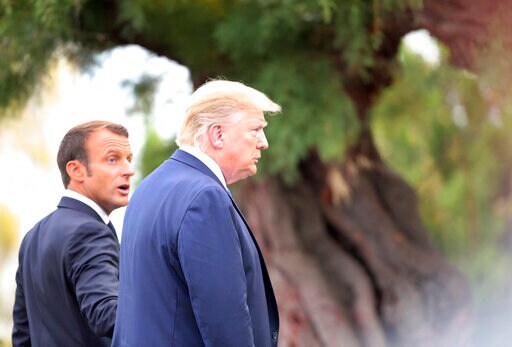 The Latest: Trump Says he May Invite Russia to Join Next G-7