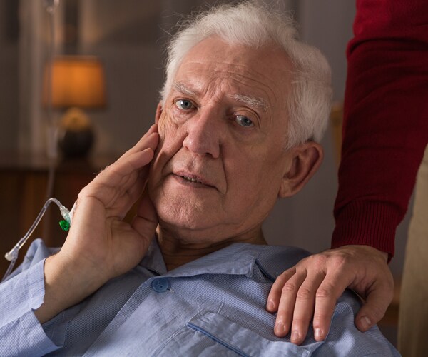 An elderly man suffering from dementia