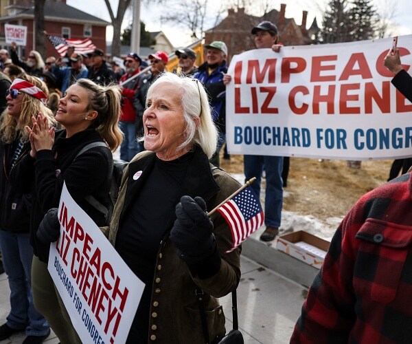 people cheer at rally against liz cheney