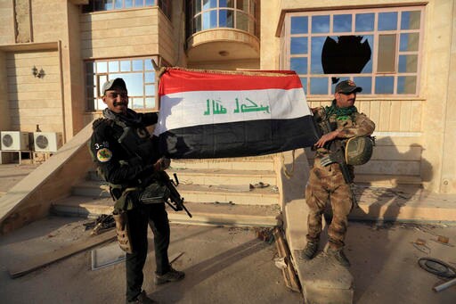 The Latest: IS Attacks Convoy near Mosul