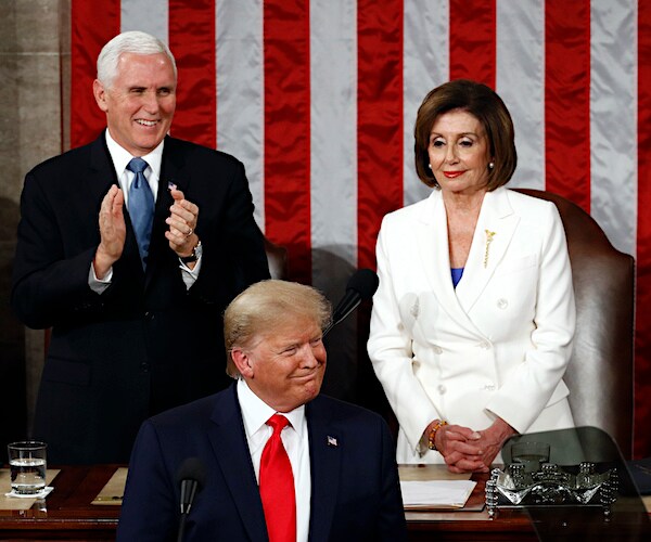 house speaker nancy pelosi stands an smirks during a presidential state of the union
