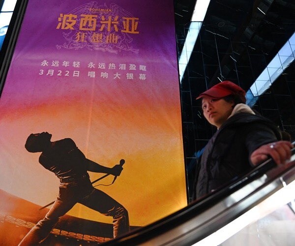 a movie poster hangs in china