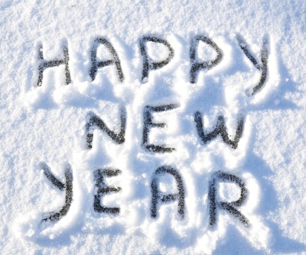 happy new year greetings written on snow