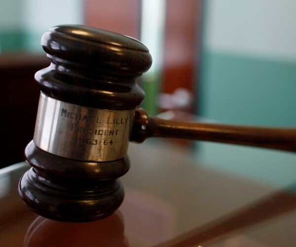 judge's gavel sits on a desk