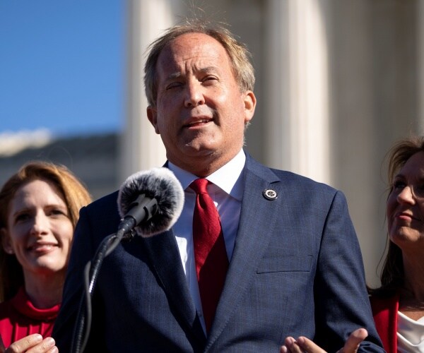 ken paxton speaks outside the u.s. supreme court