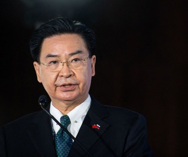 joseph wu speaks into a microphone