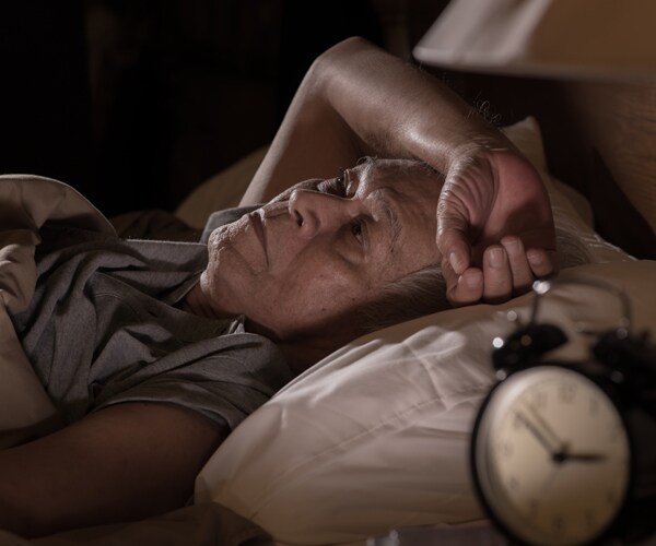 a man having a hard time sleeping