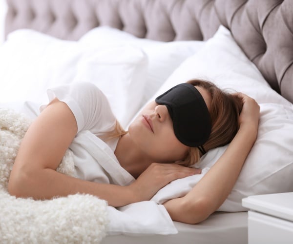 Woman with mask sleeping
