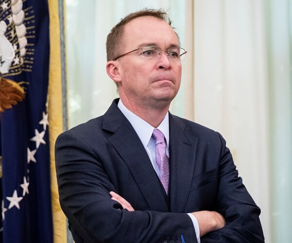 mick mulvaney stands in oval office