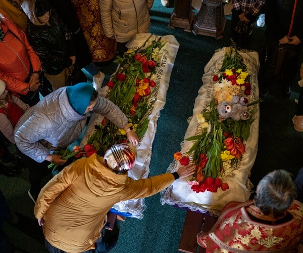 Relatives Bury Children Killed in Russian Missile Attack