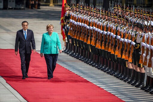 The Latest: Merkel in China Says HK Freedoms Should be Safe