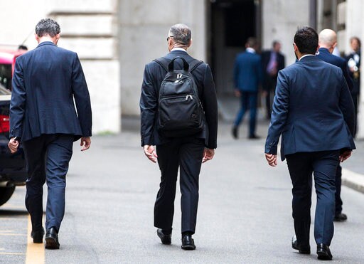 The Latest: Italy Bank Chief Warns Investors Could Flee