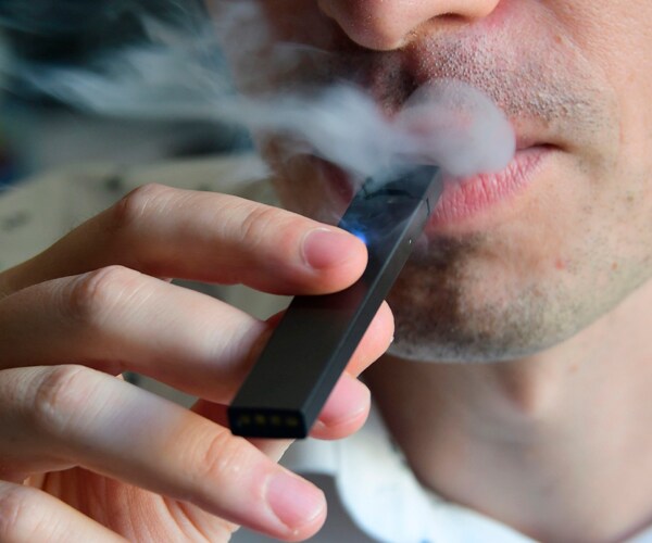 A man using an e-cigarette