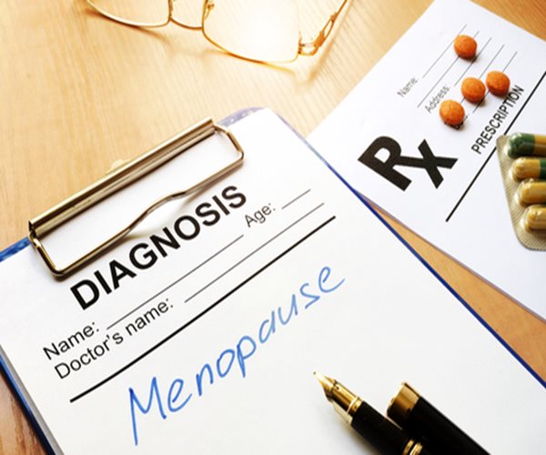 a doctor's pad with the words Diagnosis and Menopause on it