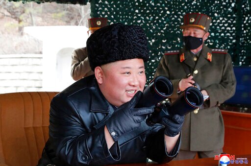 Kim Watches N Korea Military Drill Alongside Masked Officers