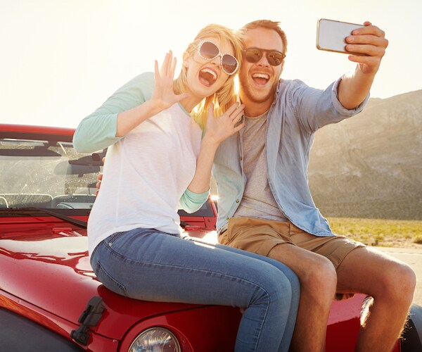 couple of vehicle of car taking selfie