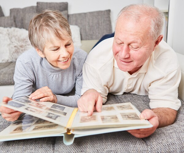 Seniors looking through a photo album