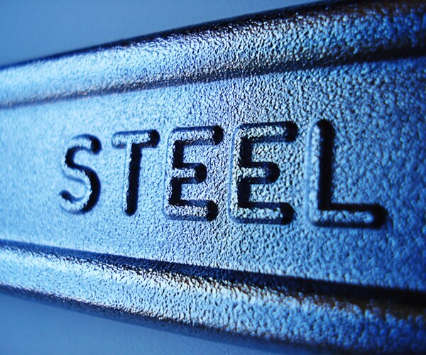 close-up of steel sign on industrial forged wrench