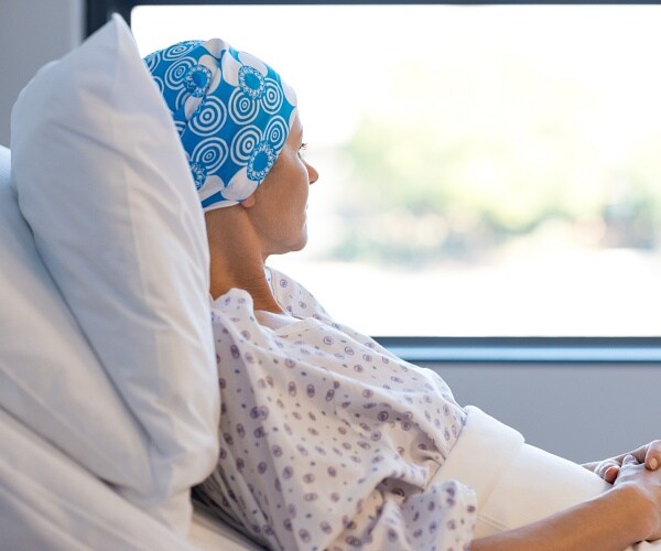 cancer patient lying in bed