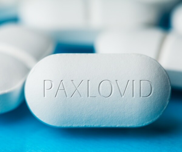 close up of Paxlovid white pill