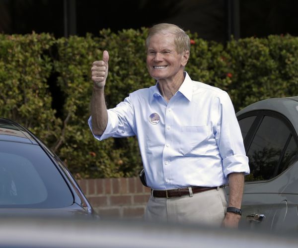 florida democrat senator bill nelson gives the thumbs up as he leaves the supervisor of elections office. 