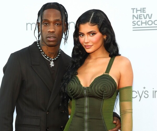 Travis Scott and Kylie Jenner pose for the cameras