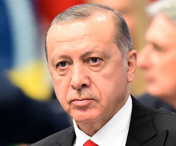 Turkish president recep tayyip erdogan looks on stoically