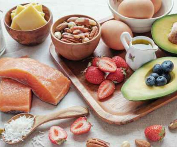 protein enriched foods recommended on a ketogenic diet are shown like salmon, fruits, eggs, cheese and nuts