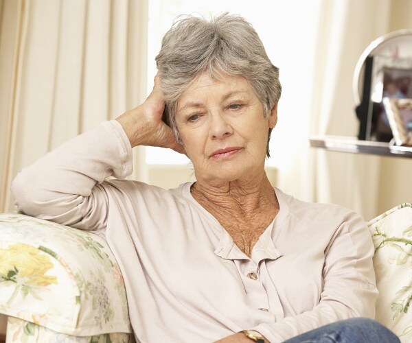 woman sitting on sofa