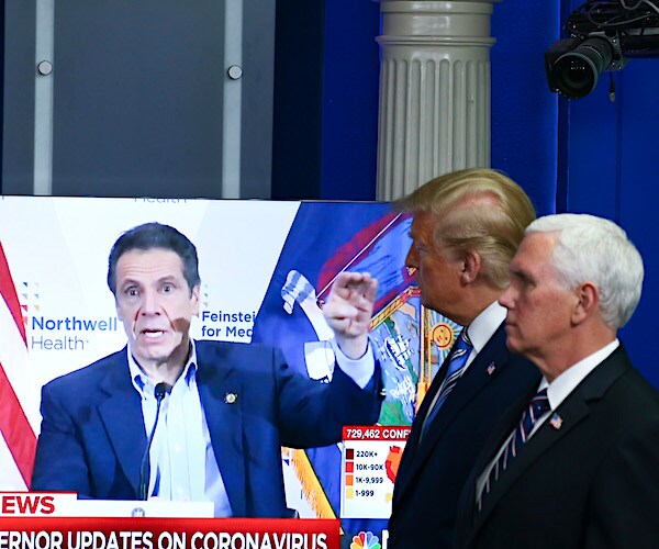 President Donald Trump and Vice President Mike Pence watch a video of New York Gov. Andrew Cuomo