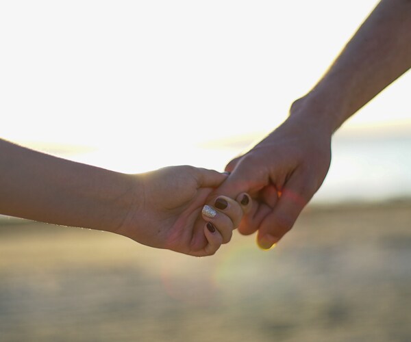 a couple holding hands