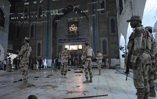 The Latest: Death Toll in Pakistan Shrine Attack Reaches 80
