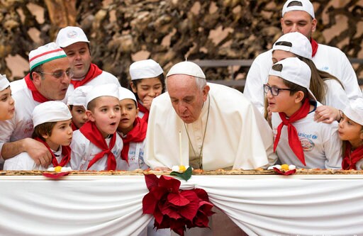 Pope Francis Blows out Birthday Candle on Extra-long Pizza