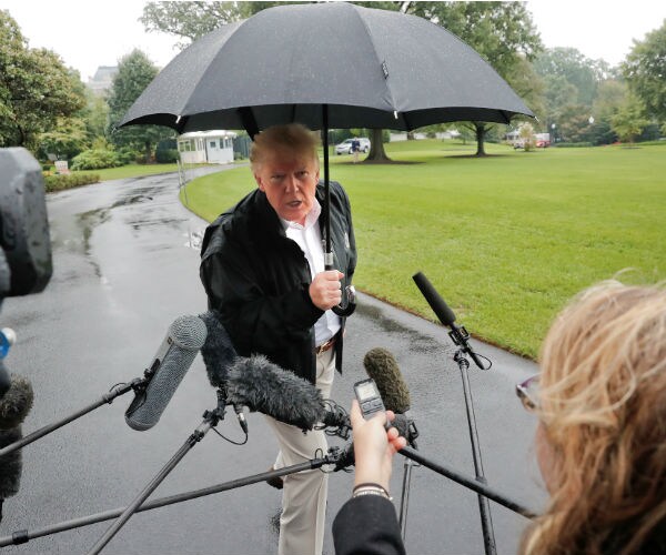 president donald trump volleys questions from members of the press `1
