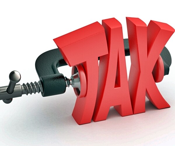 word tax in clamp, tax reduction concept

