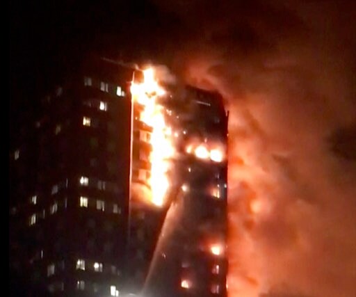 The Latest: Residents Being Evacuated from Burning Building