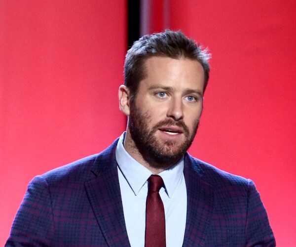 armie hammer speaks into mic
