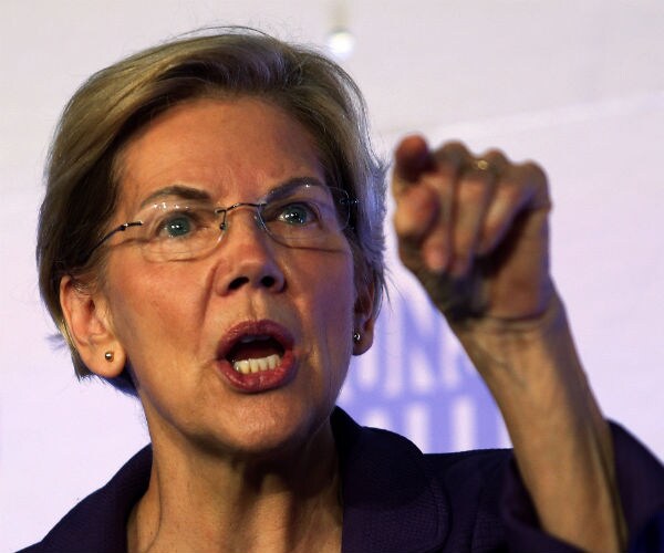 sen. elizabeth warren gestures with her fingers as she speaks at a summit