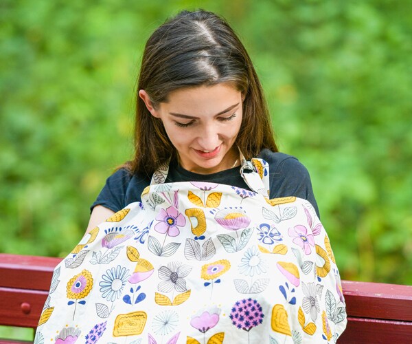 a mom feeding her baby