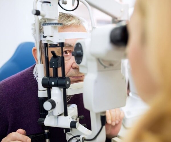 older man undergoing eye exam