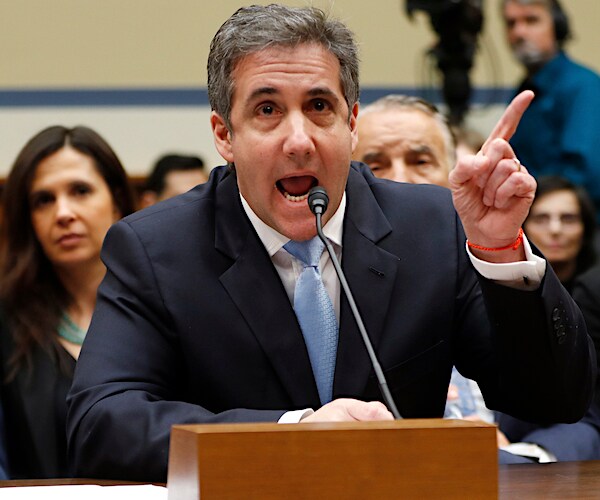 michael cohen exults and points aggressively with his left hand
