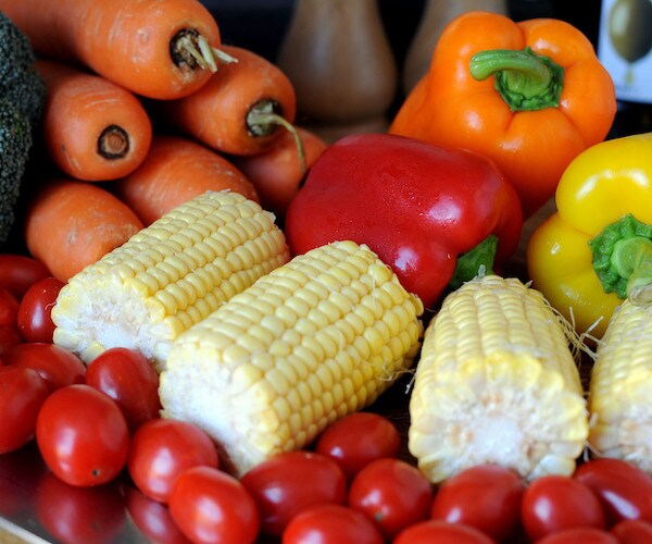 vegetables are piled up on a table