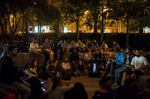 The Latest: Spain Official: Police Acting 'professionally'