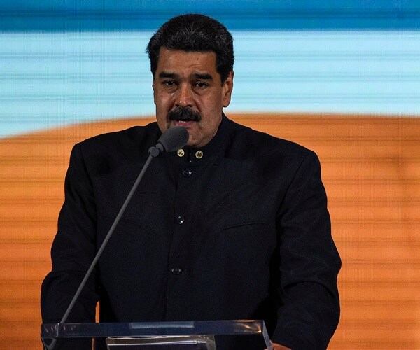 president nicolas maduro speaks at a conference