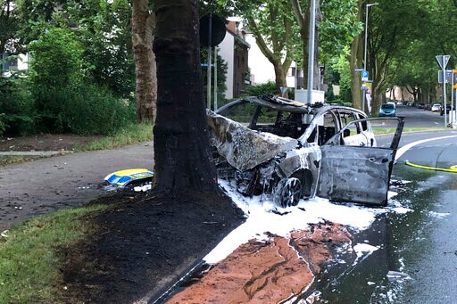 Students Rescue German Police from Burning Patrol Car