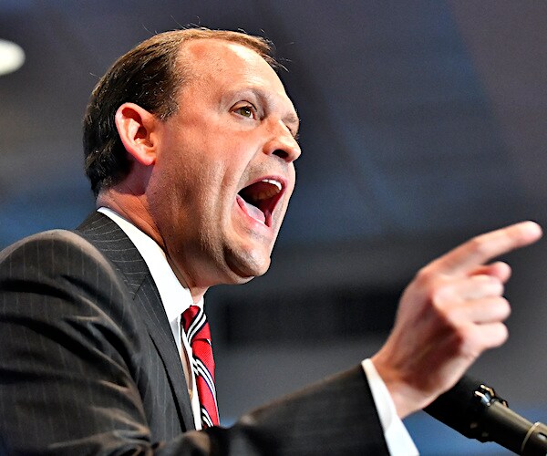 andy barr gestures and exults during an impassioned speech