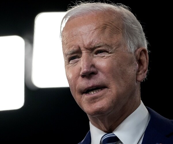 joe biden speaks into mic