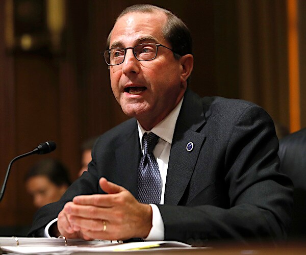 secretary alex azar sits and speaks during a congressional hearing