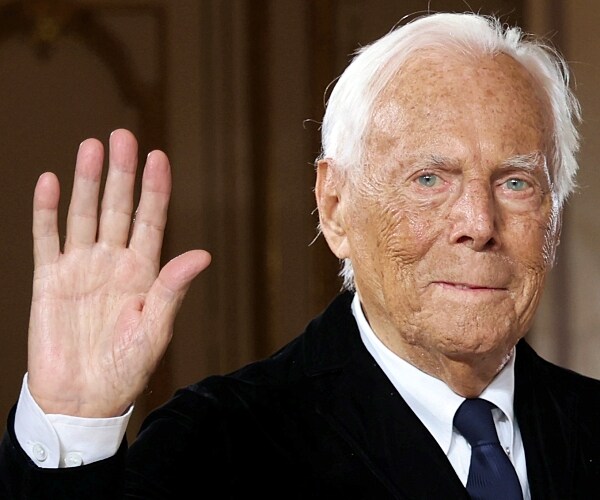 giorgio armani facing forward, waving